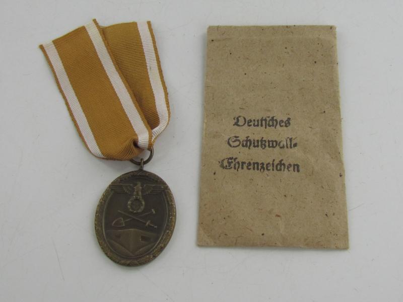 Westwall Medal with Paper Bag